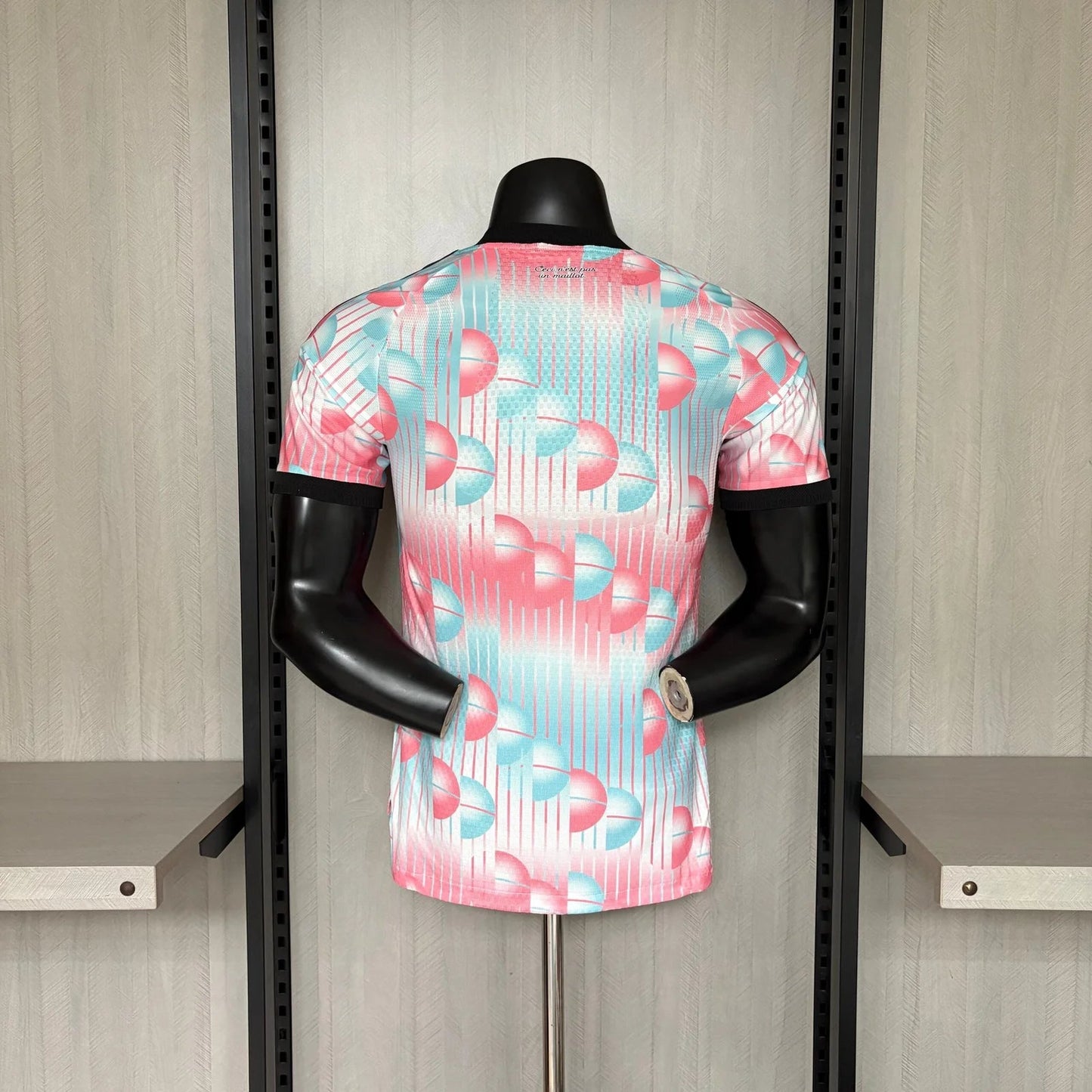 Mannequin wearing a colorful patterned shirt in a store setting