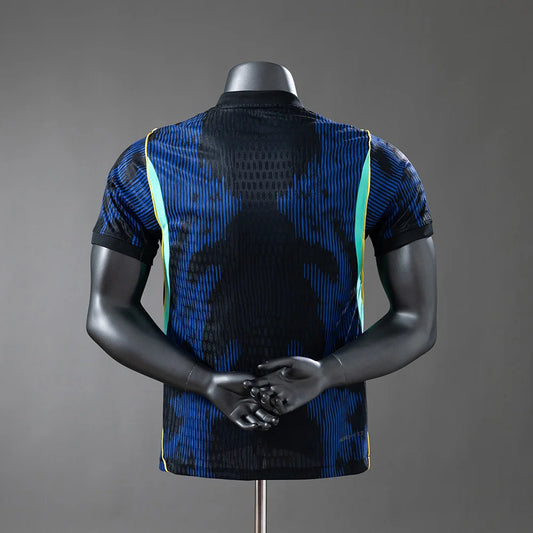 Mannequin wearing a blue and black patterned shirt on a gray background