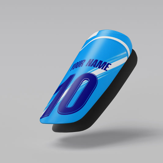 Blue shin guard with customizable text on a gray background