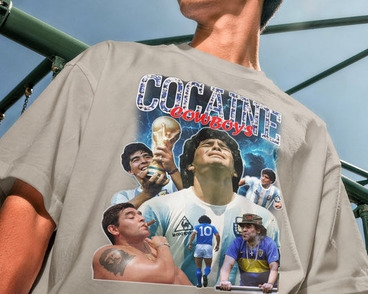 Person wearing a t-shirt with graphic designs and text, including images of people and a trophy.