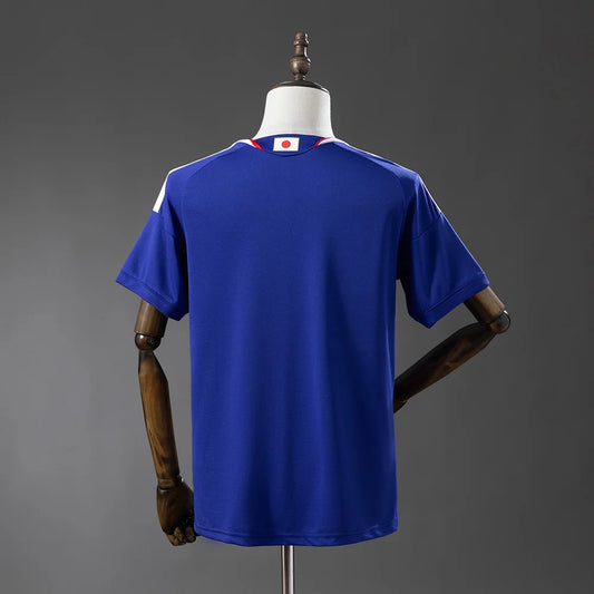 Blue sports jersey on a mannequin against a gray background