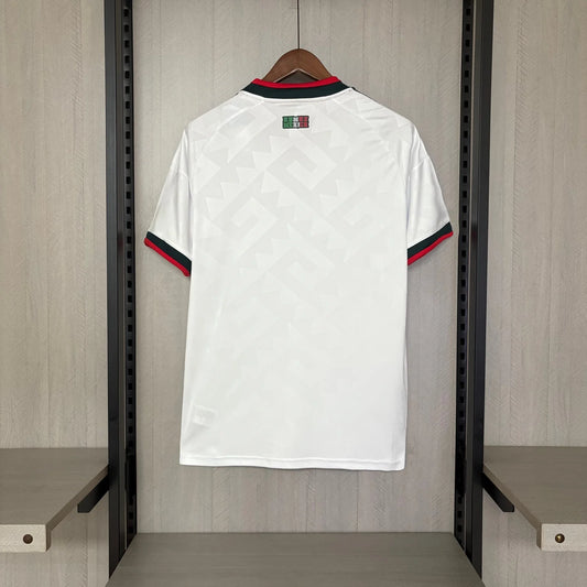 White sports jersey with red and blue accents hanging in a locker room.