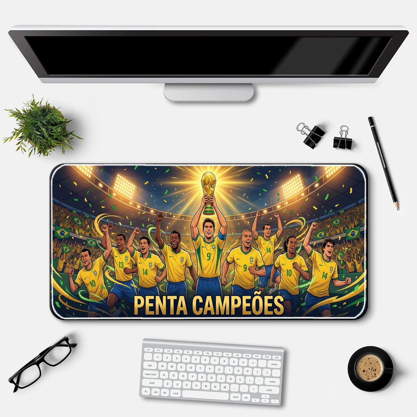 Desk setup with a large mouse pad featuring a soccer team holding a trophy, surrounded by office supplies.