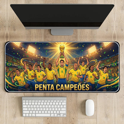 Desk setup with a large mouse pad featuring a soccer team celebrating a victory, placed on a wooden desk.