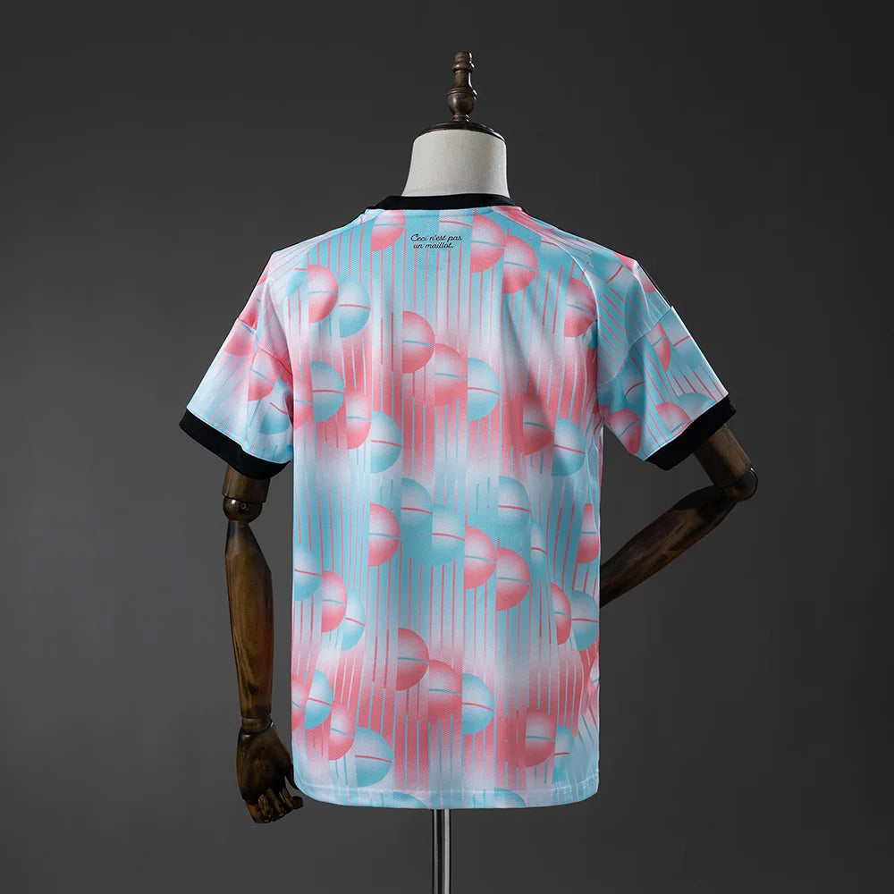 Mannequin wearing a light blue and pink patterned shirt on a gray background
