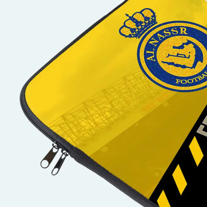 Yellow laptop sleeve with Al Nassr Football Club logo on a white background