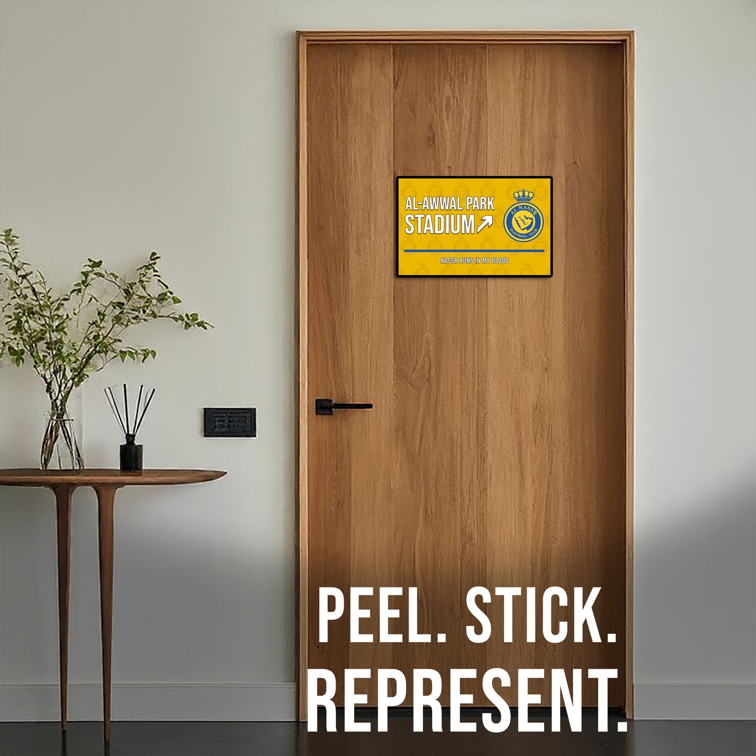 Wooden door with a decorative sign and 'Peel. Stick. Represent.' text.