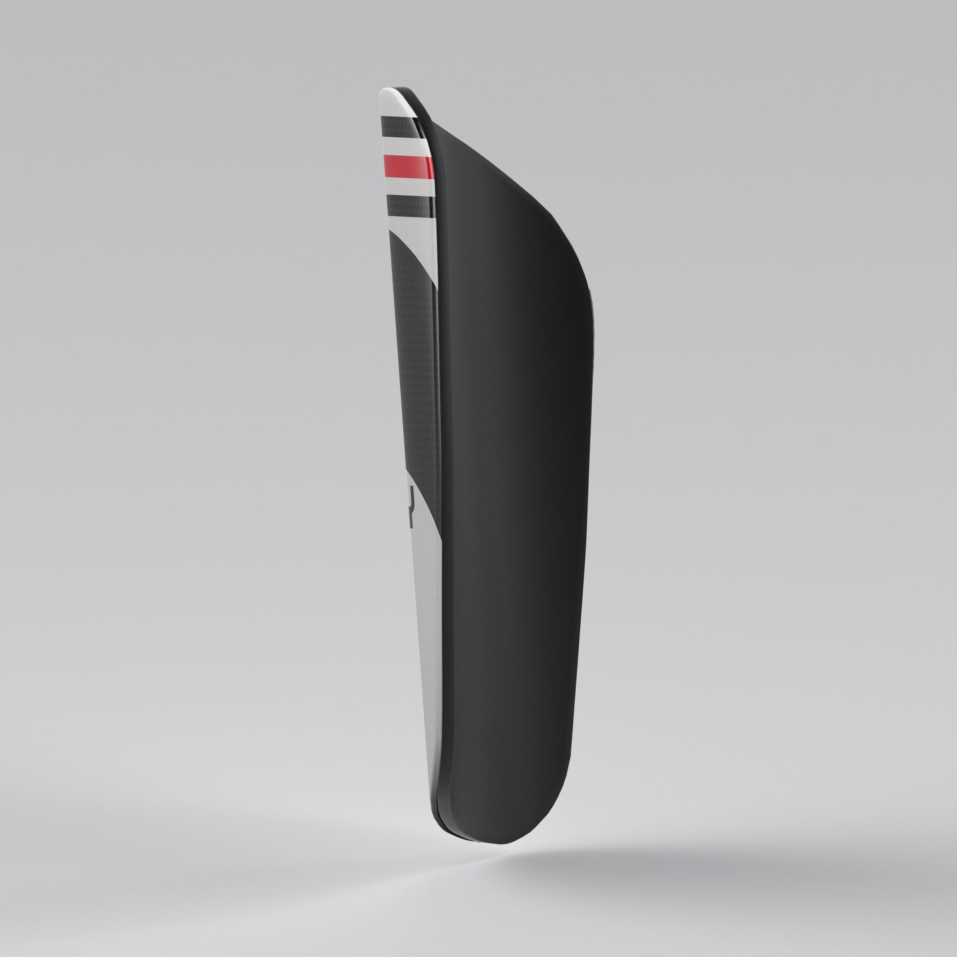 Black shoe sole with a striped pattern on a gray background