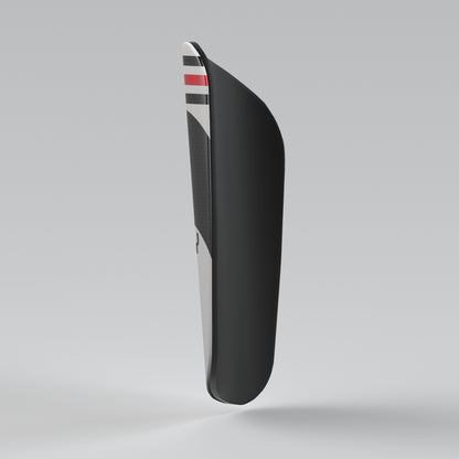 Black shoe sole with a striped pattern on a gray background