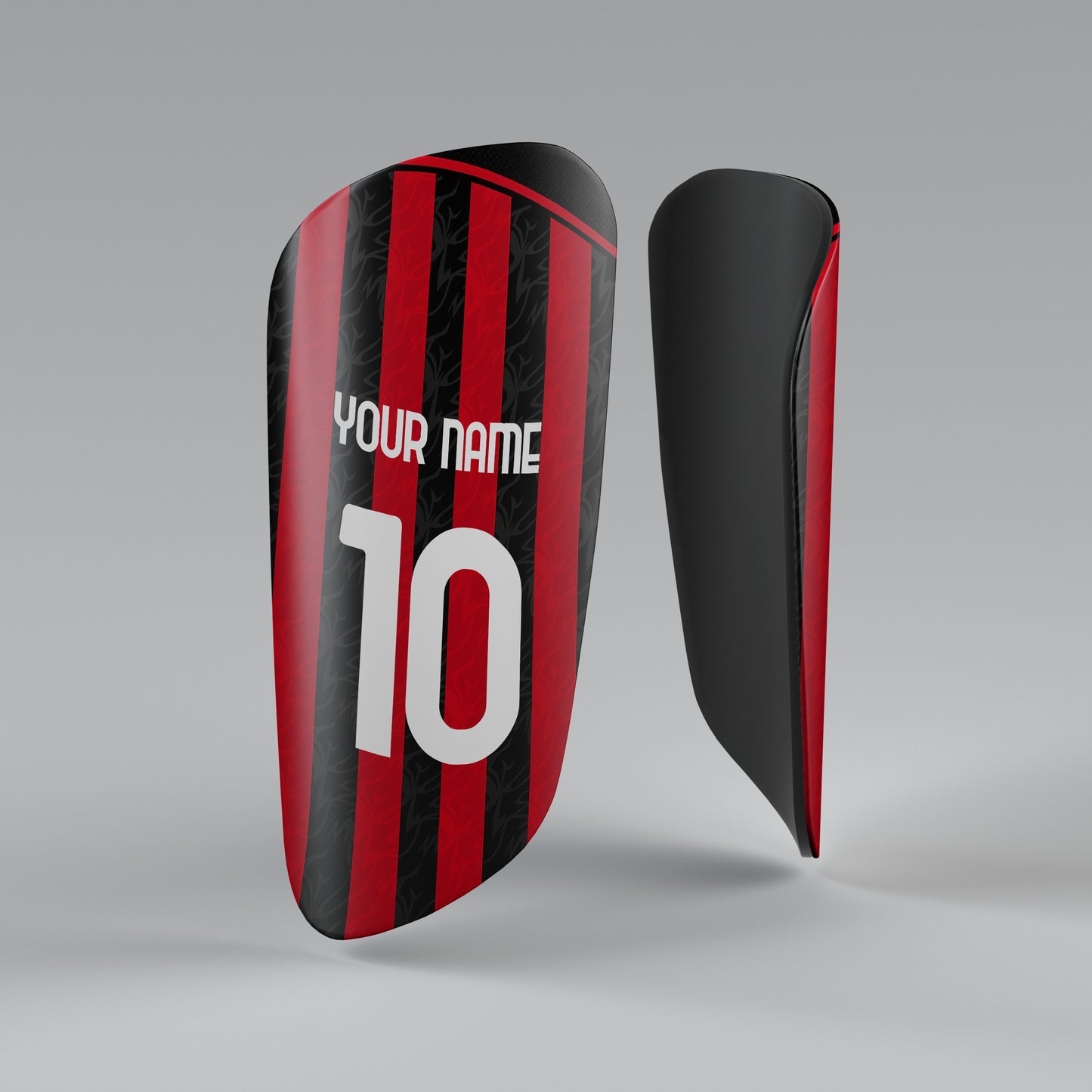 Black and red shin guard with customizable text on a gray background