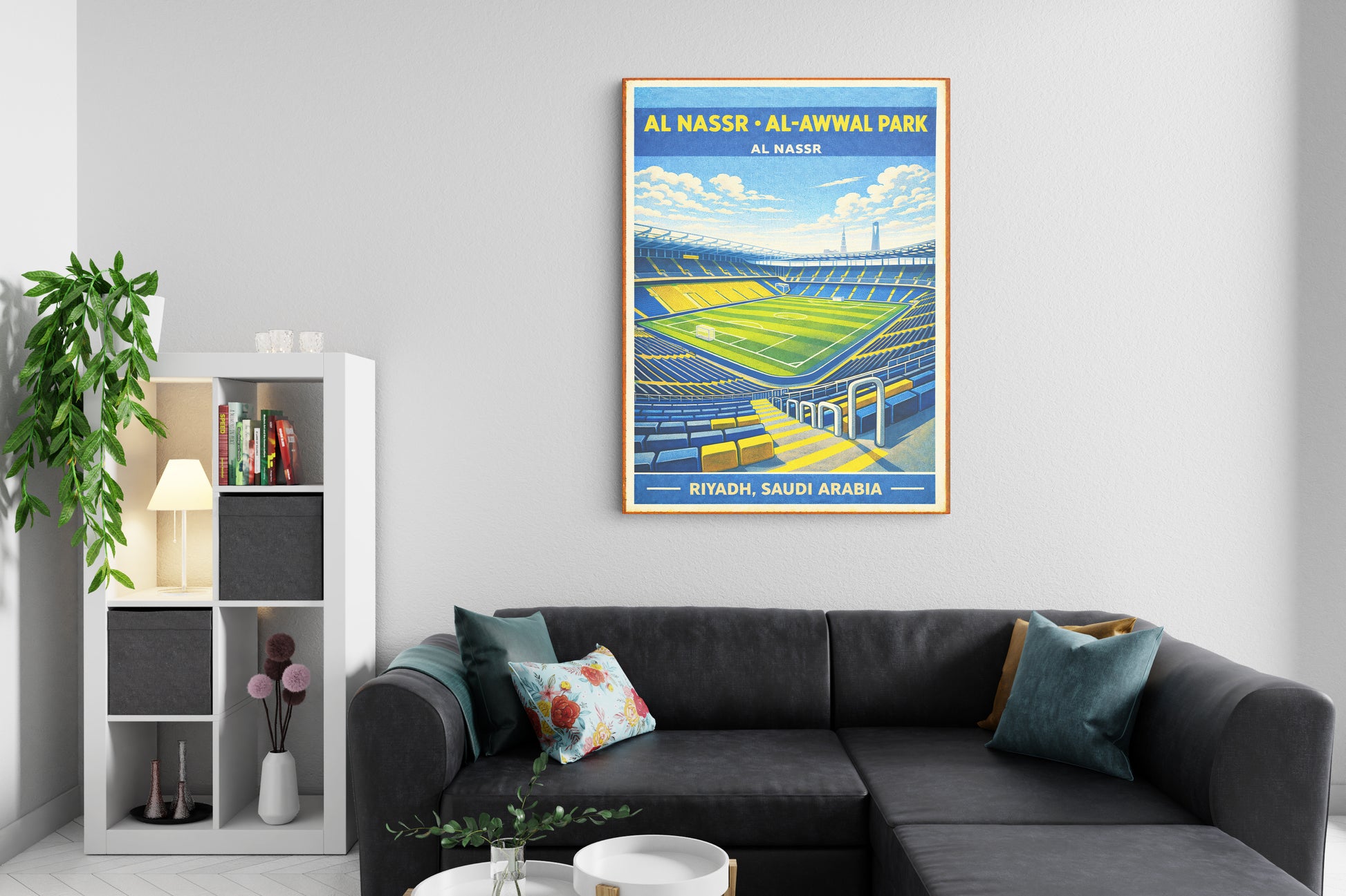 Poster of Al Nasser Al-Awwal Park in a living room with a gray sofa and decorative items.