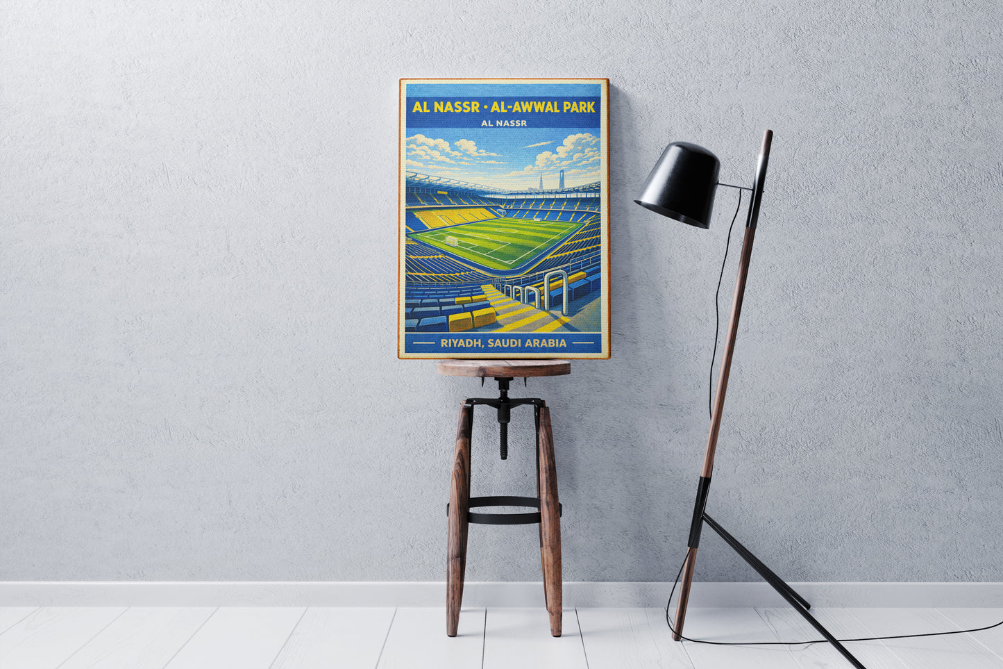 Poster of Al Nasr Al-Awwal Park on a stool against a gray wall.