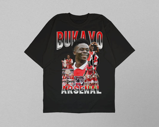 Black t-shirt with Arsenal player graphic and text on a gray background