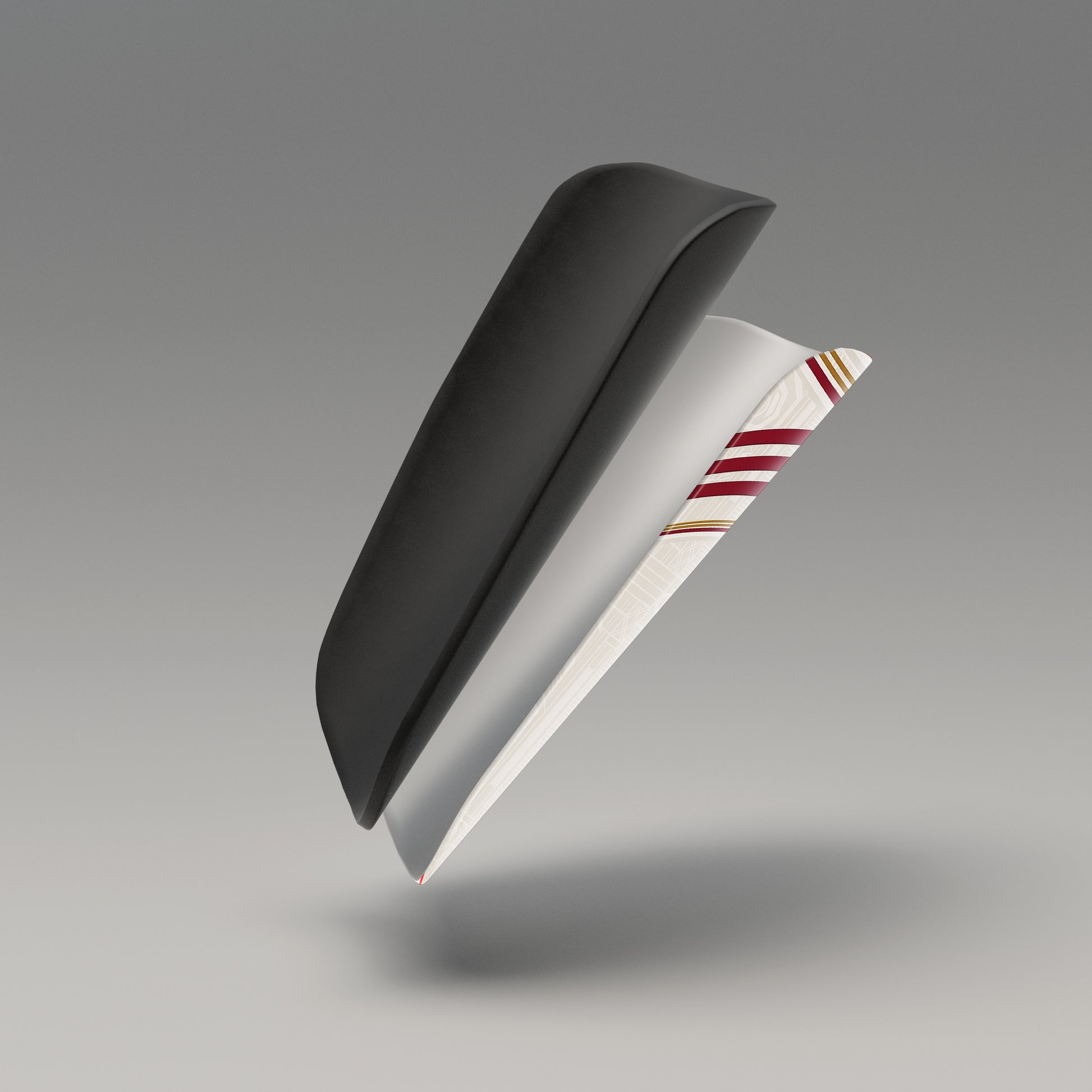 Black and white object with red and gold stripes on a gray background