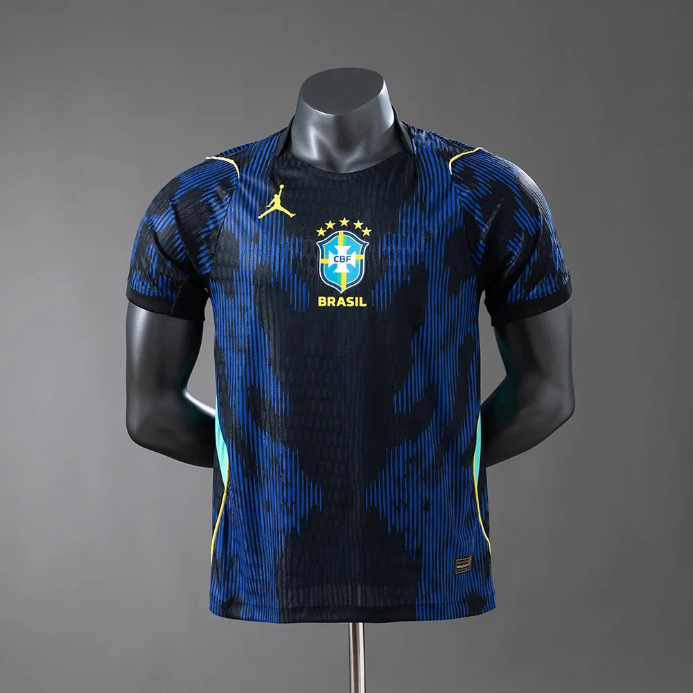 Blue and black sports jersey with 'Brasil' text on a mannequin against a gray background