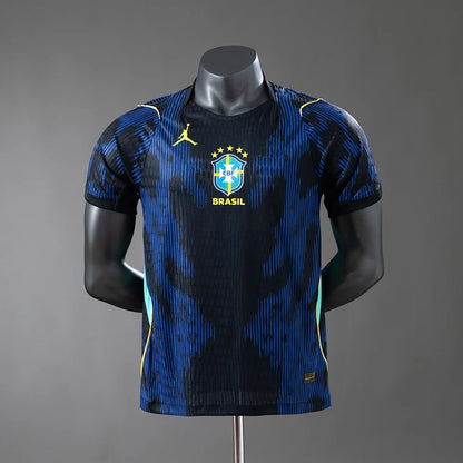 Blue and black sports jersey with 'Brasil' text on a mannequin against a gray background