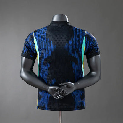 Mannequin wearing a blue and black patterned shirt on a gray background