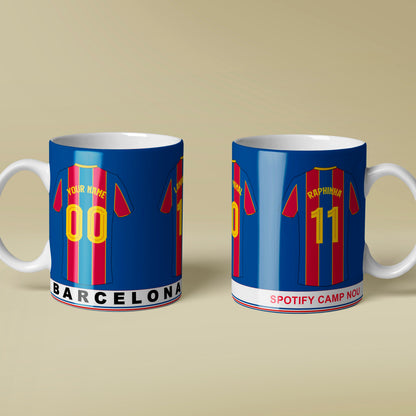 Two mugs with Barcelona football club design on a beige background