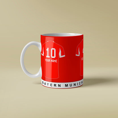 Red mug with Bayern Munich soccer jersey design on a beige background