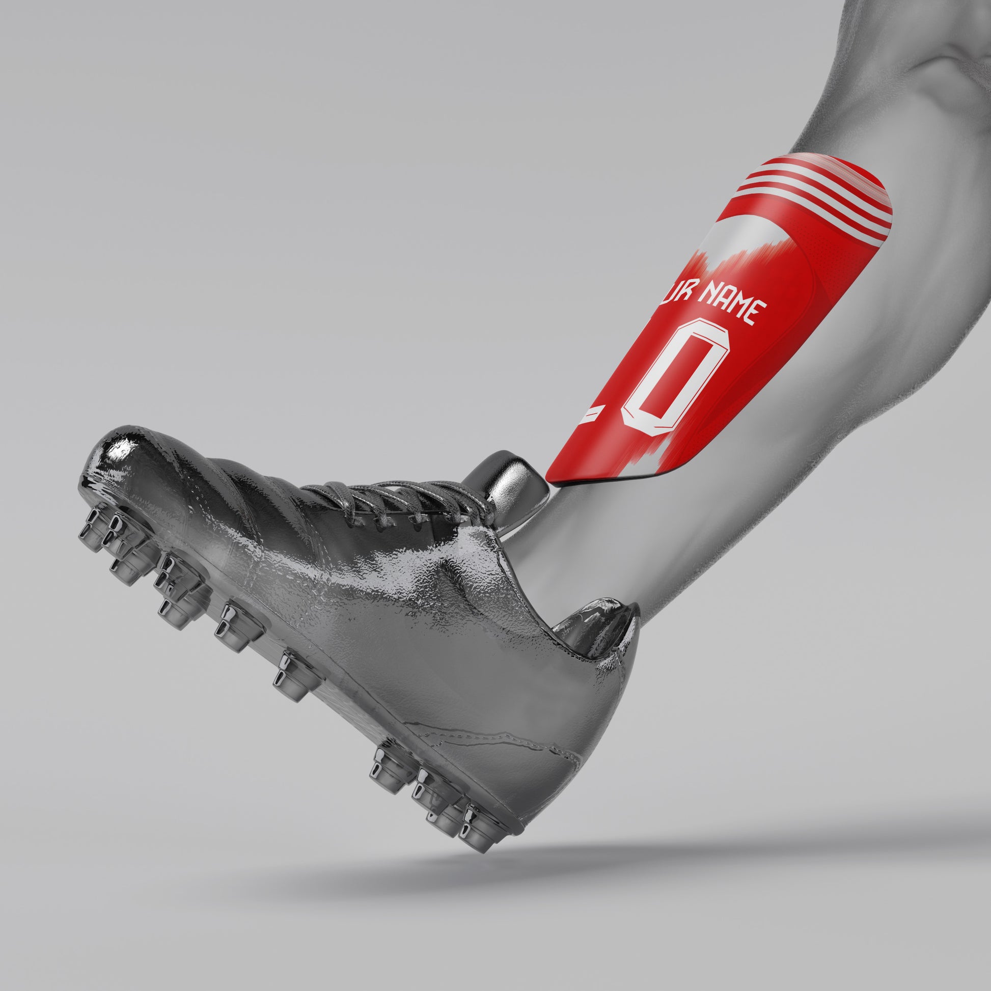 Gray soccer cleat with red shin guard on a gray background