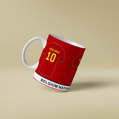 Red mug designed like a Belgium national team jersey on a beige background