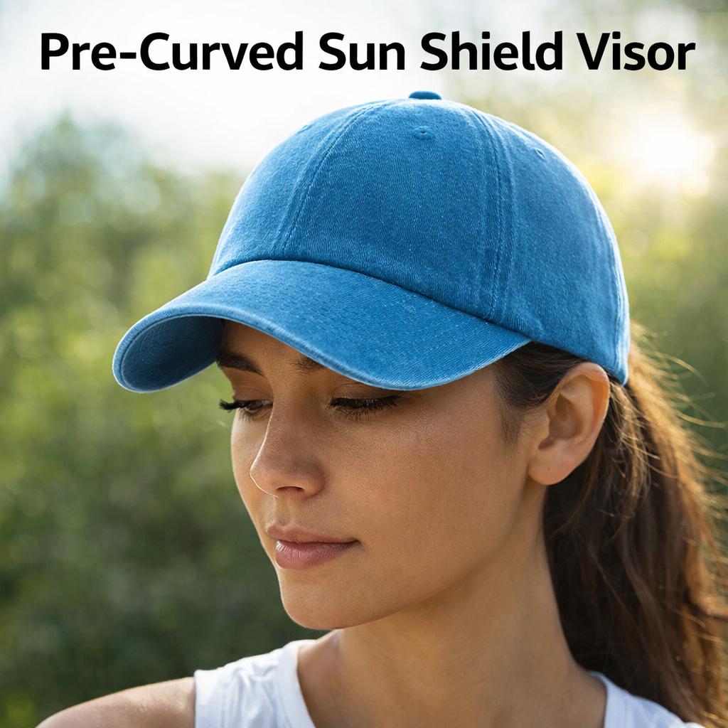 Woman wearing a blue pre-curved sun shield visor with a blurred green background