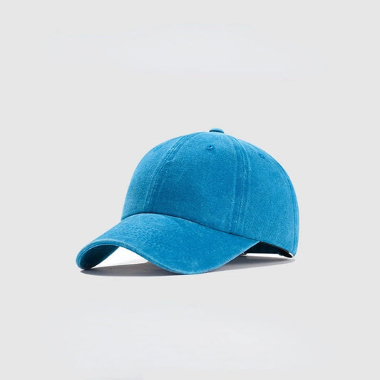 Blue baseball cap on a light gray background