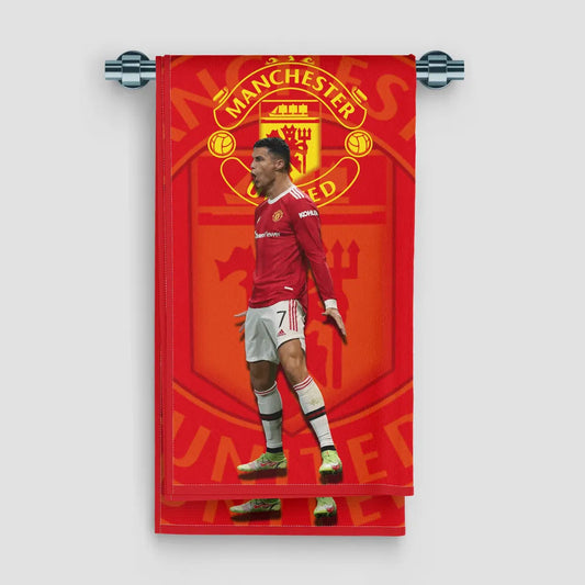 Man United-themed towel with a player in a red and white kit on a red background