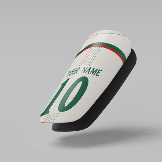 White sock with green text and numbering on a gray background