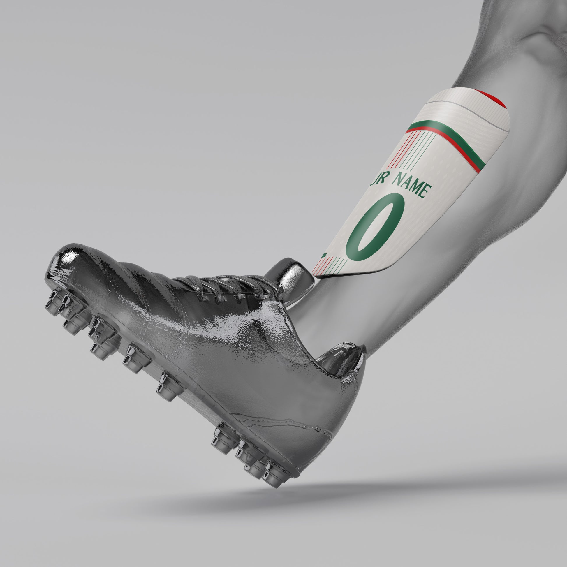 Gray soccer cleat with a white shin guard featuring green and red accents on a gray background