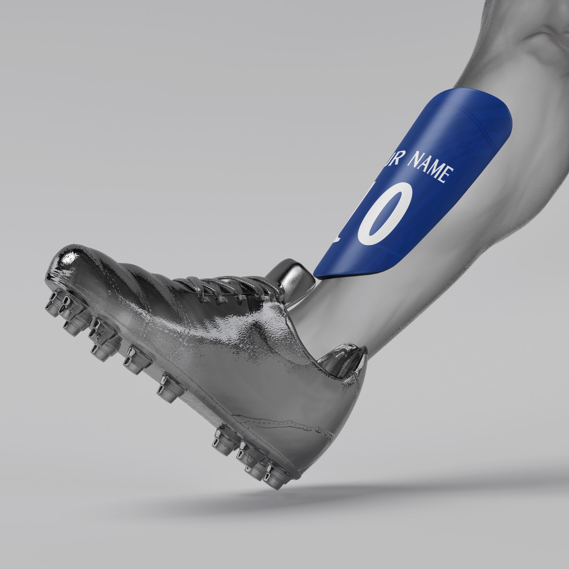 Gray soccer cleat with a blue shin guard labeled 'Your Name' on a gray background