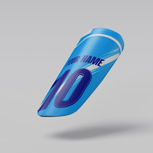 Blue shin guard with customizable text on a gray background