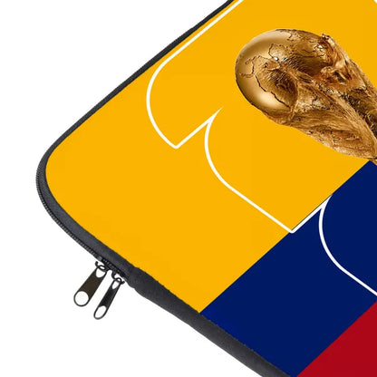 Laptop sleeve with a gold soccer ball on a yellow and blue background