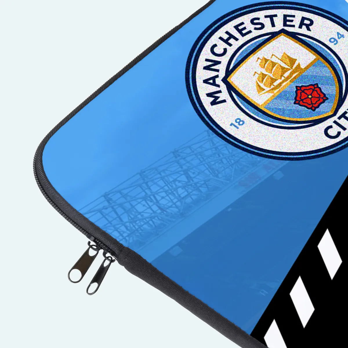 Blue pouch with Manchester City logo on a light gray background