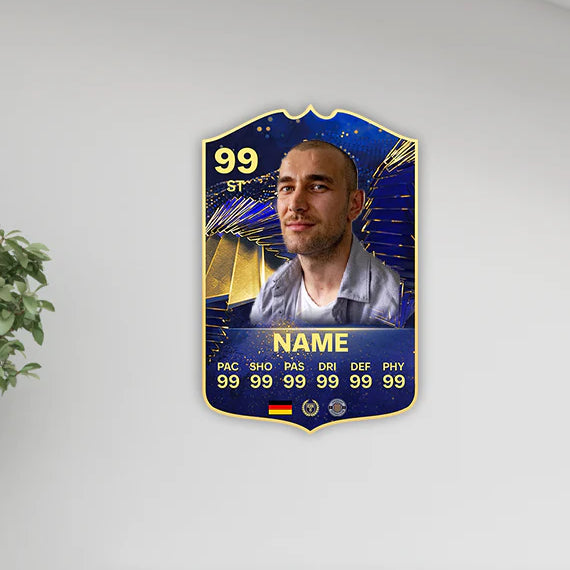 Futuristic player card with a face on a white wall above a bookshelf.