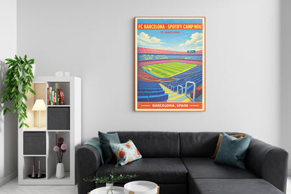 Living room with a gray sectional sofa, decorative pillows, and a framed poster of FC Barcelona's Camp Nou stadium on the wall.