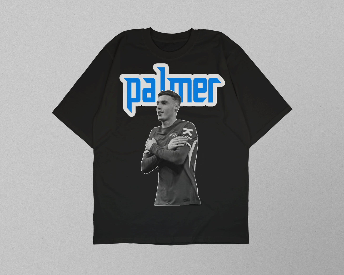 Black t-shirt with a graphic of a person and the name 'palmer' on a gray background
