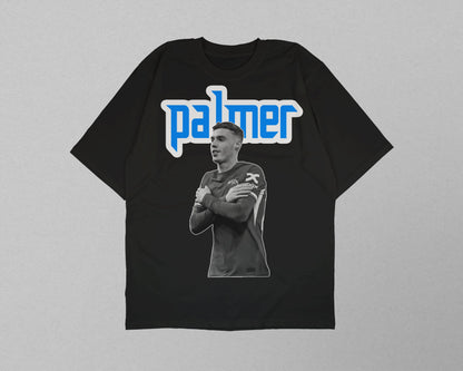 Black t-shirt with a graphic of a person and the name 'palmer' on a gray background