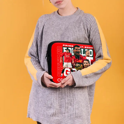 Person holding a red and black case with images and text on a yellow background