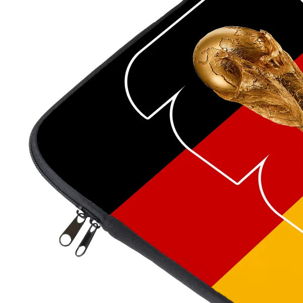 Laptop sleeve with a design of a gold soccer ball on a black, red, and yellow background