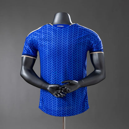 Blue sports jersey on a black mannequin against a gray background