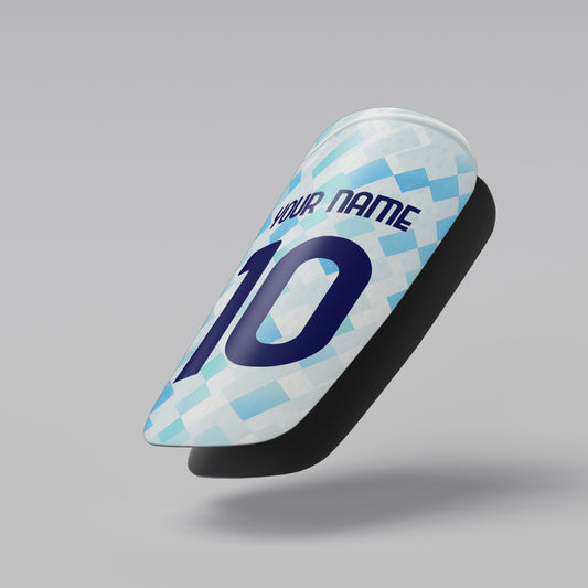 Soccer cleat with checkered pattern and customizable text on a gray background