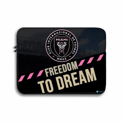 Laptop sleeve with Club Internacional de Fótbol Miami logo and 'Freedom to Dream' text on a black background