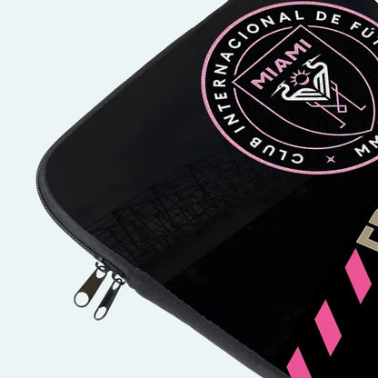 Black pouch with pink and white logo and text on a light gray background