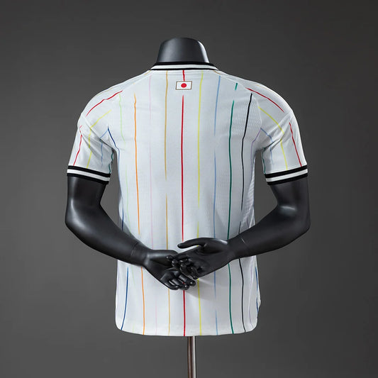 Mannequin wearing a white sports jersey with colorful stripes on a dark background