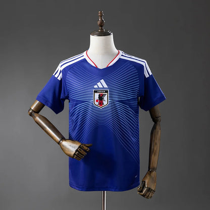 Blue sports jersey with Adidas logo on a mannequin against a gray background