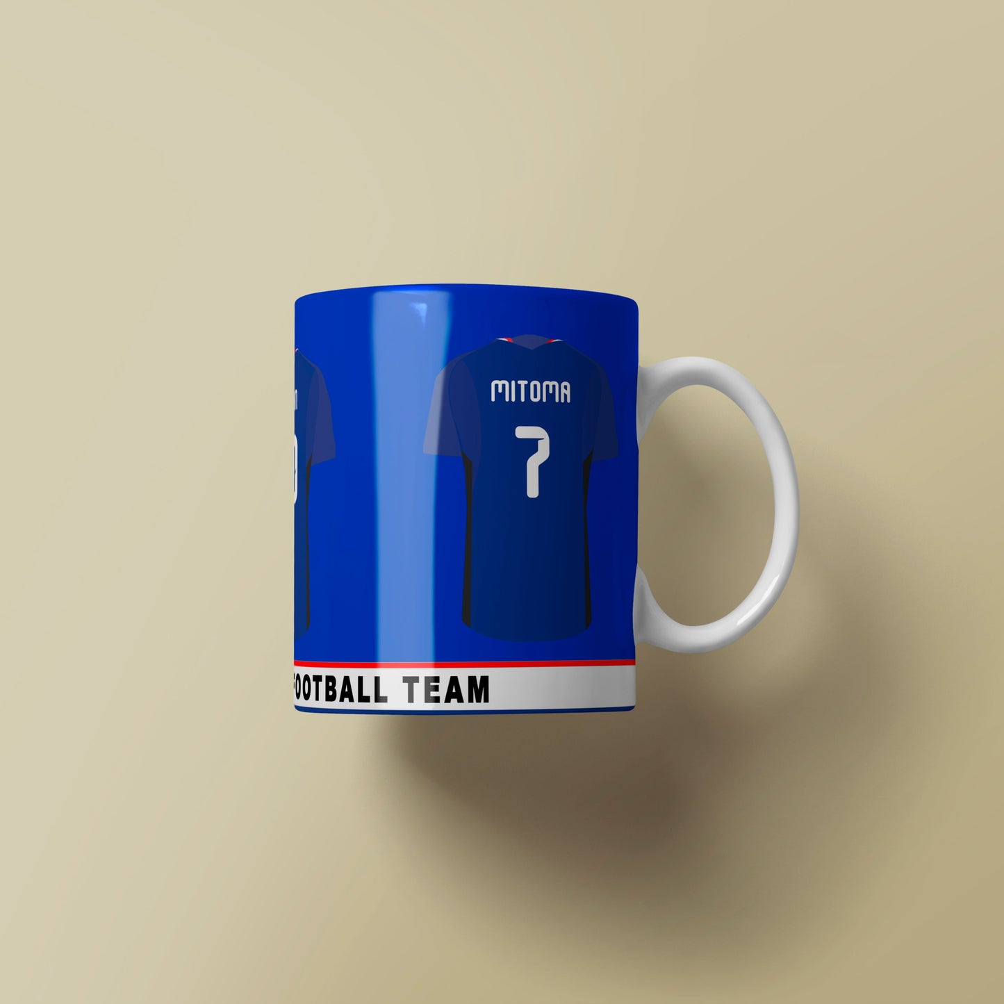 Blue mug with white handle resembling a sports jersey on a beige background