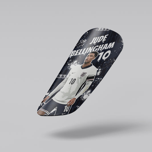 Skateboard deck with a soccer player design and text on a gray background