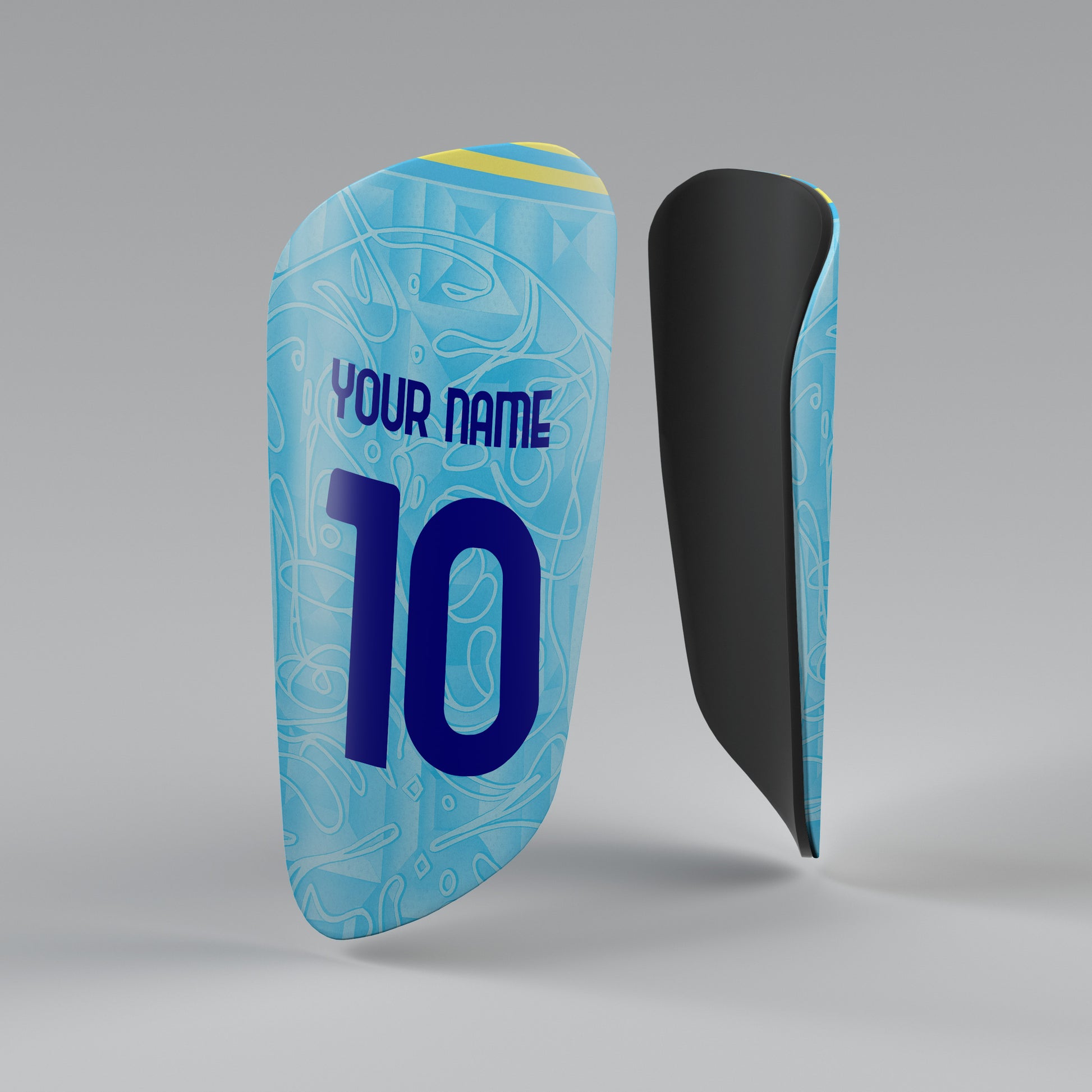 Blue shin guard with number 10 and text 'Your Name' on a gray background