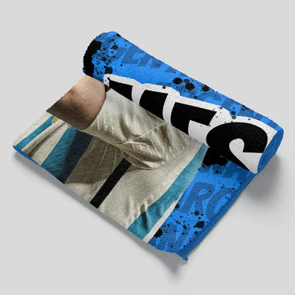 Blue pouch with a graphic design on a gray background